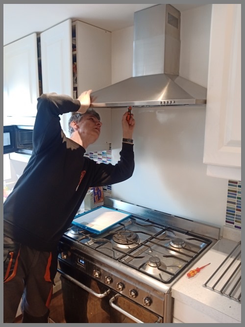Kitchen hood installer in Cardiff preparing a reliable commercial extraction installation
